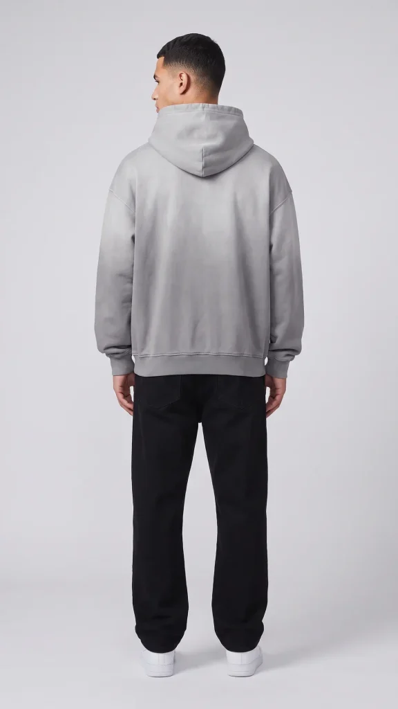Back view of the Toxic NYC Script Heavyweight Sunfade Oversized Hoodie on a model