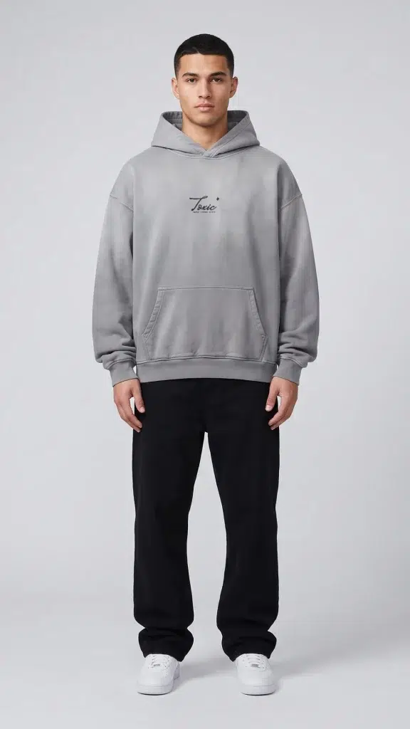 Man wearing the Toxic NYC Script Heavyweight Sunfade Oversized Hoodie