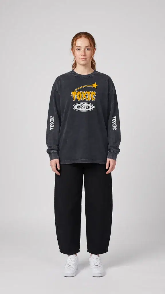 Woman wearing the Toxic NYC Waste Co. Snow Washed Long Sleeve T-Shirt with baggy jeans